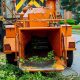 Wood chipper machine releasing the shredded woods into a truck chipper machine to remove